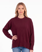 Burgundy oversized crew neck knit sweater with ribbed cuffs and ribbed hem
