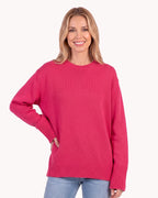 Hot pink oversized crew neck knit sweater with ribbed cuffs and ribbed hem