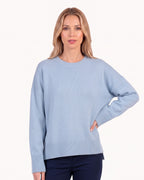 Light blue oversized crew neck knit sweater with ribbed cuffs and ribbed hem