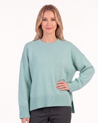 Mint green oversized crew neck knit sweater with ribbed cuffs and straight hem