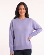 Light purple oversized crewneck sweater with long sleeves and wide ribbed hem and cuffs