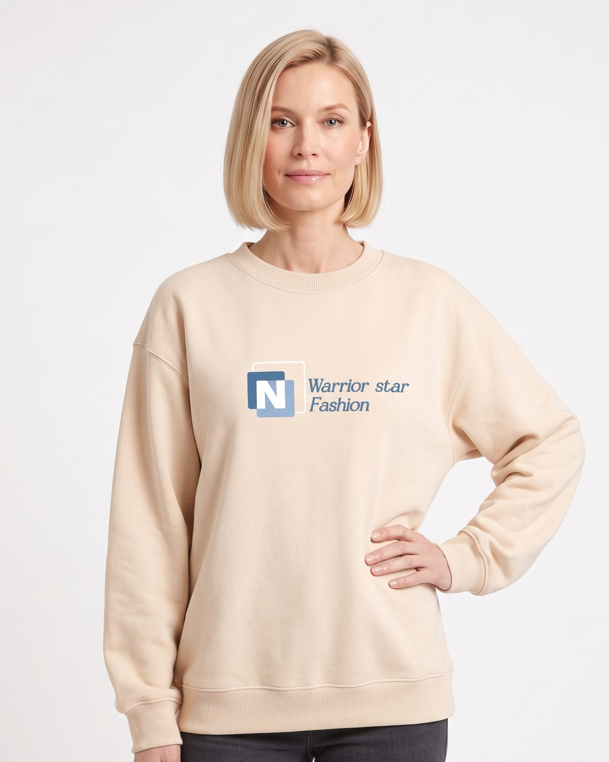 Beige crewneck sweatshirt with N logo graphic, long sleeves, ribbed cuffs.