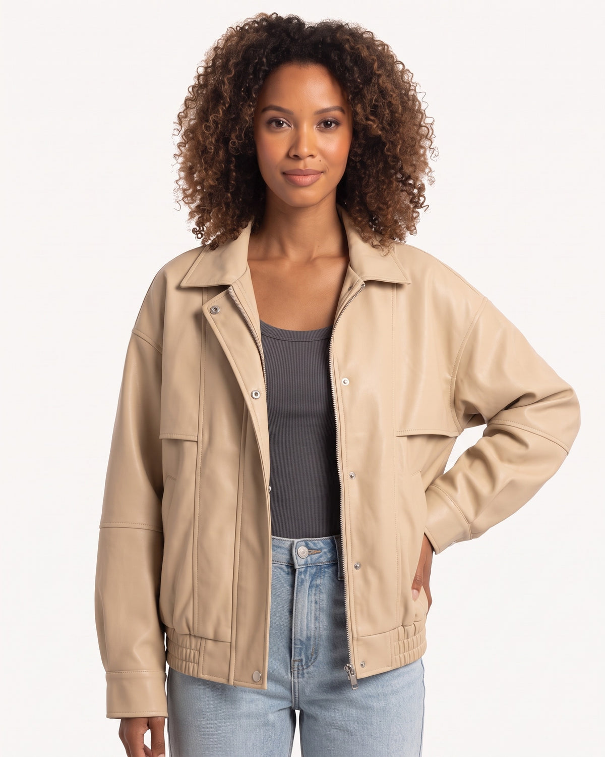 Beige faux leather bomber jacket with snap buttons and ribbed elastic cuffs