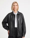 Black faux leather bomber jacket with point collar, zip front, ribbed cuffs
