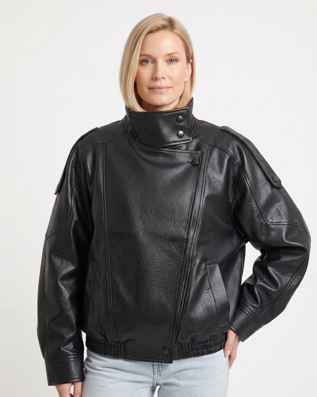 Black faux leather oversized jacket with stand collar, snap buttons, and zip front