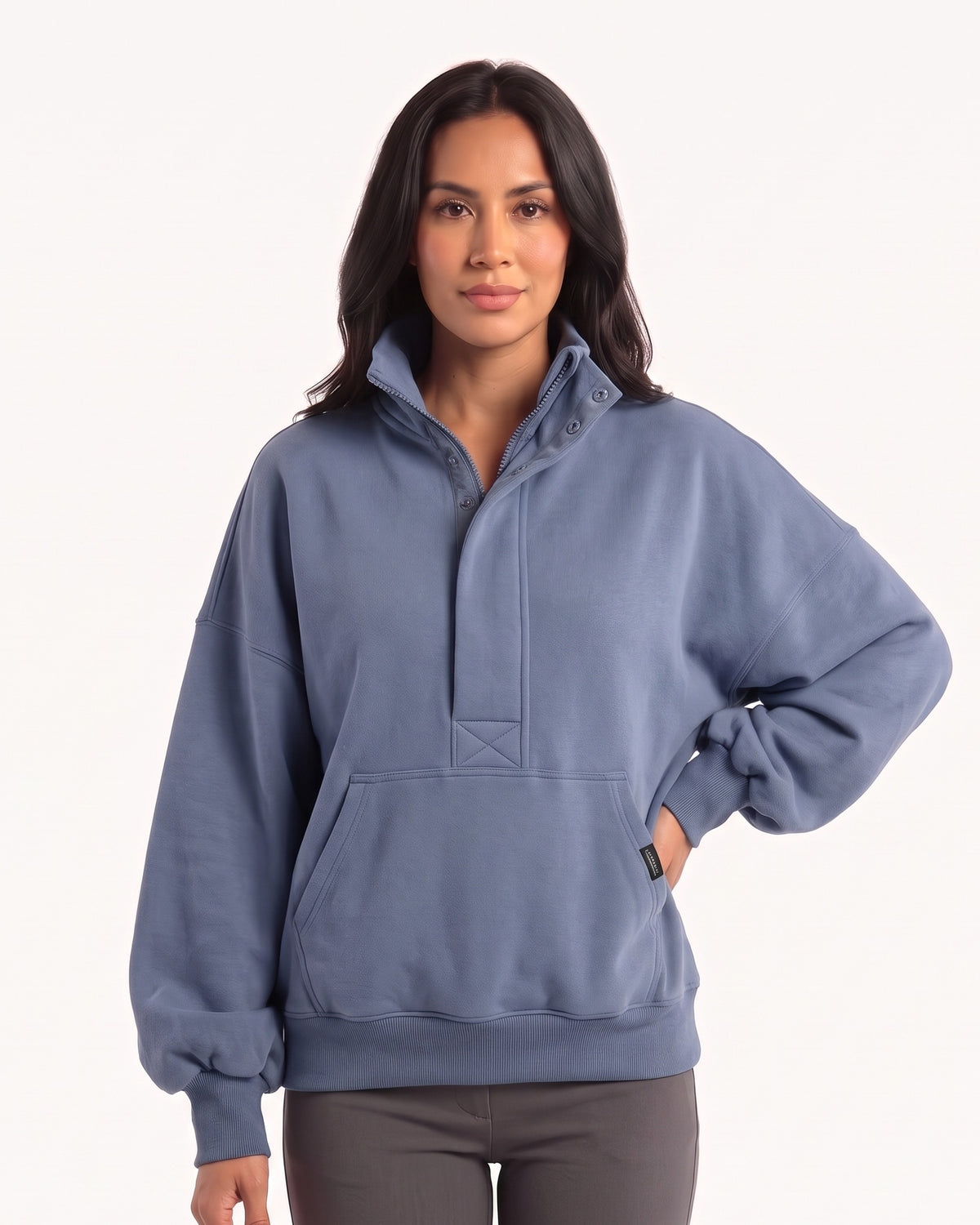 Oversized denim blue half-zip sweatshirt with funnel neck and kangaroo pocket