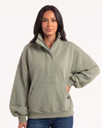 Women's oversized sage green half-zip sweatshirt with funnel neck and kangaroo pocket