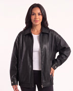 Black oversized faux leather bomber jacket with collar, zip front, drop shoulders and snap cuffs