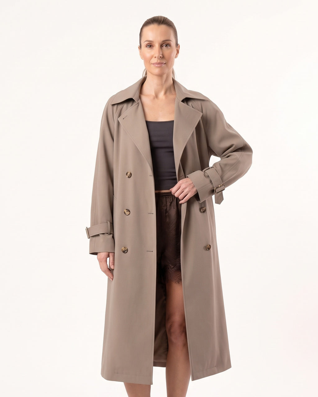Khaki long double-breasted trench coat with belt, wide lapels, and buckled cuffs