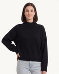 Oversized mock neck sweater in black with ribbed mock neck and cuffed sleeves
