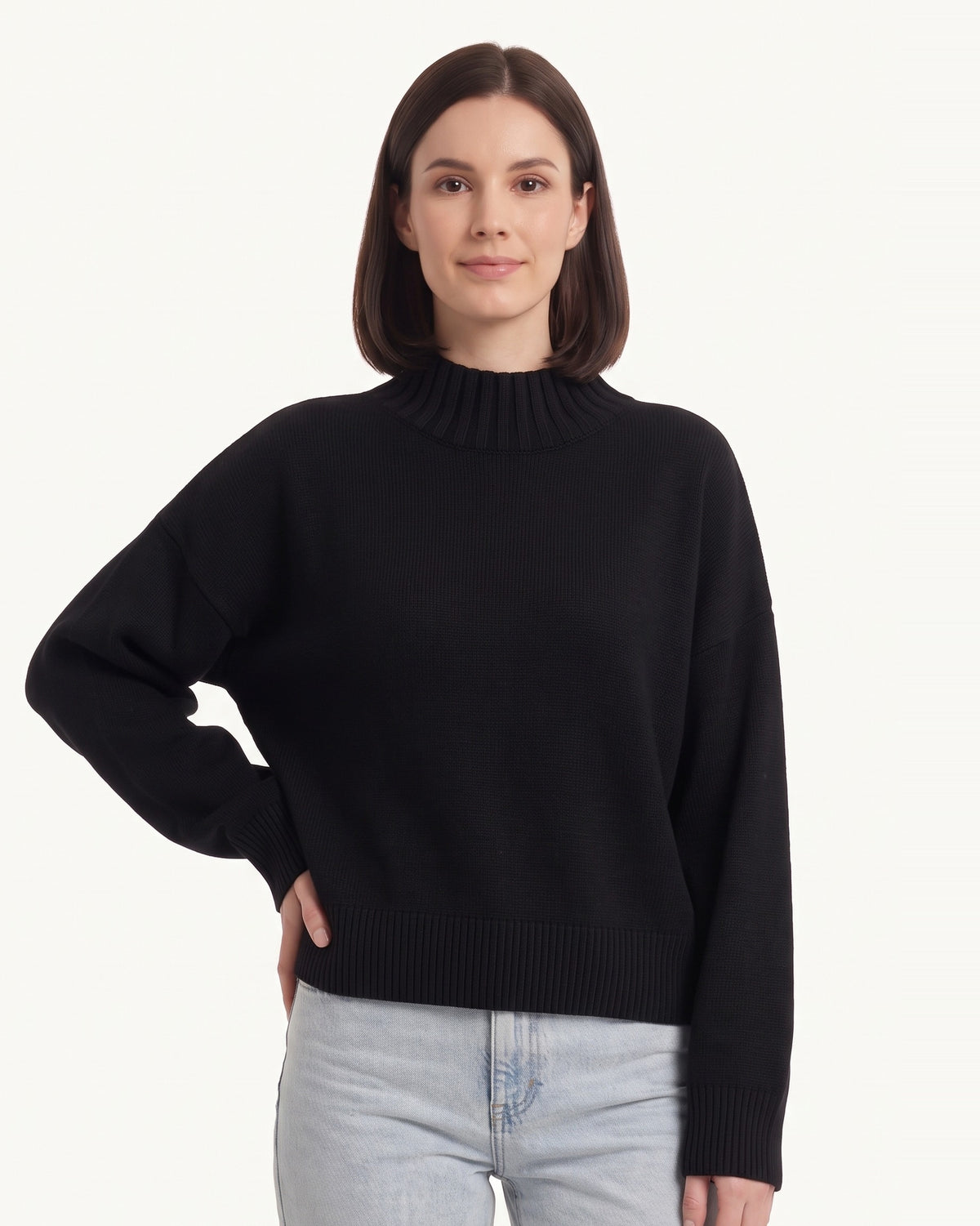 Oversized mock neck sweater in black with ribbed mock neck and cuffed sleeves