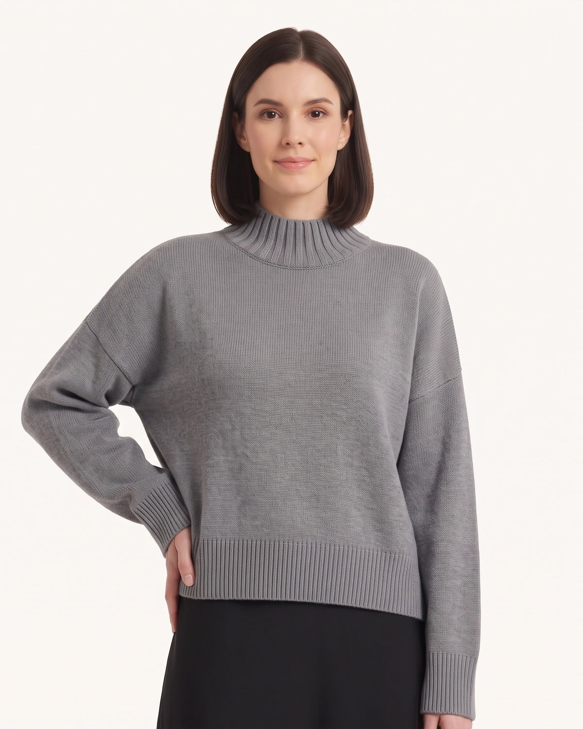 Women’s oversized mock neck sweater in gray with balloon sleeves and ribbed cuffs