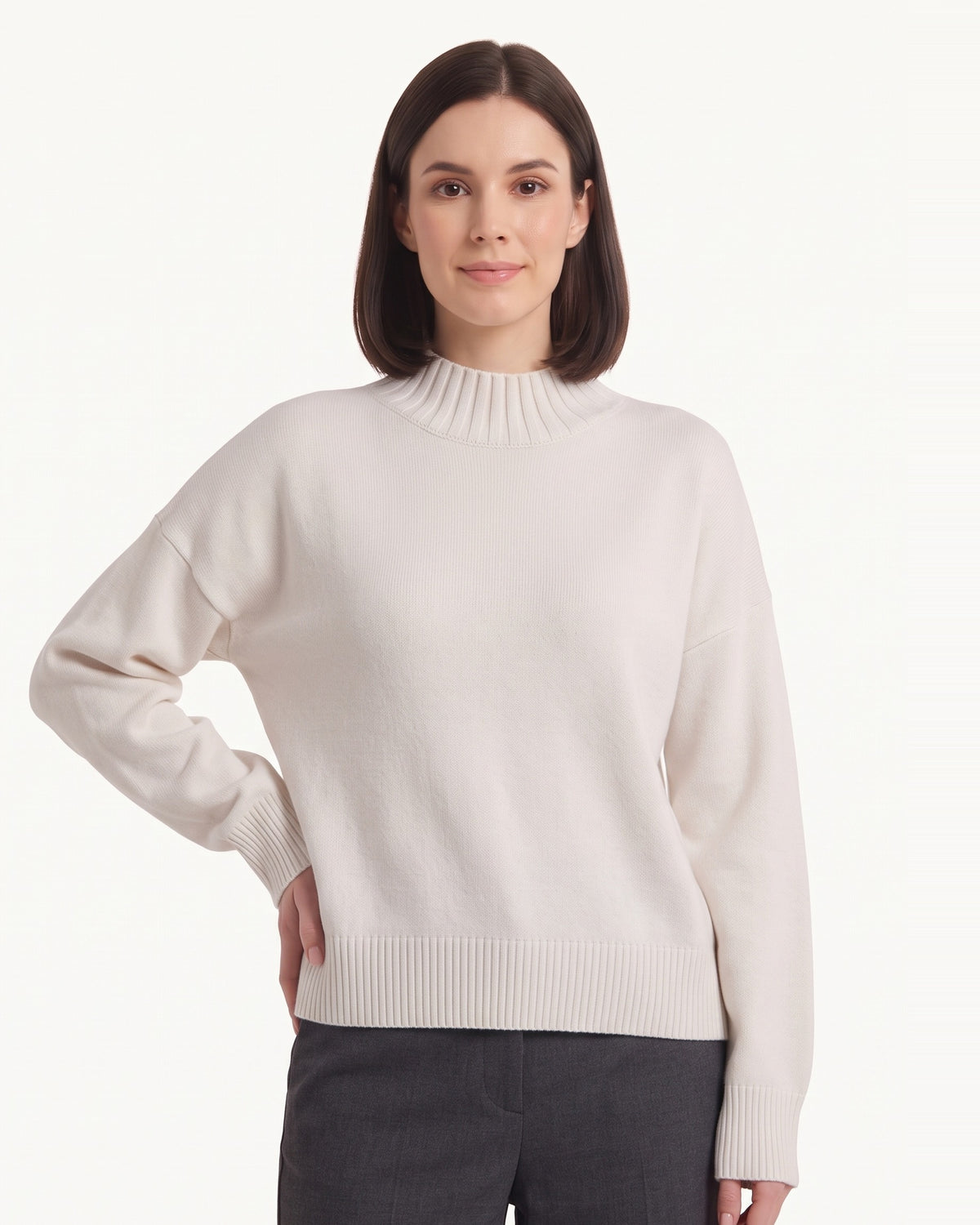 Oversized mock neck sweater in light cream with ribbed hem and mock collar