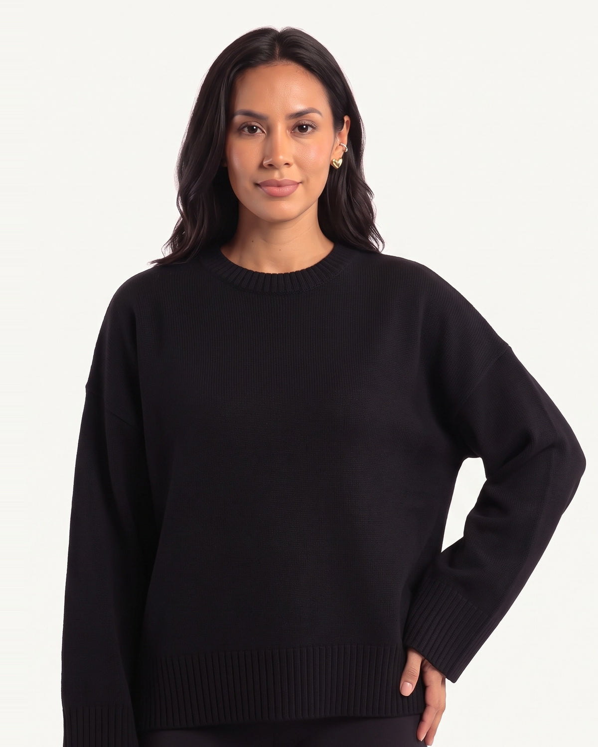 Black oversized crewneck knit sweater with wide ribbed cuffs and ribbed hem