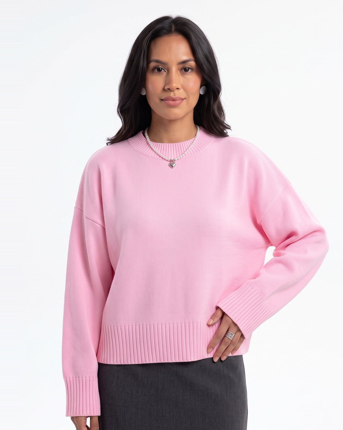 Pink oversized crewneck knit sweater with wide ribbed cuffs and ribbed hem