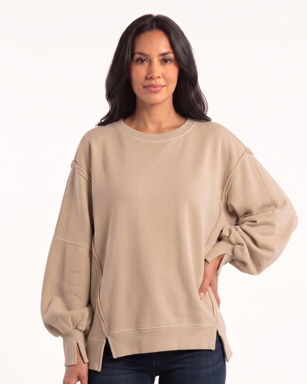 Beige oversized sweatshirt with batwing sleeves, long cuffs, and side slits