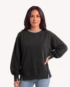 Women's oversized black sweatshirt with batwing sleeves, exposed seams, and side slits