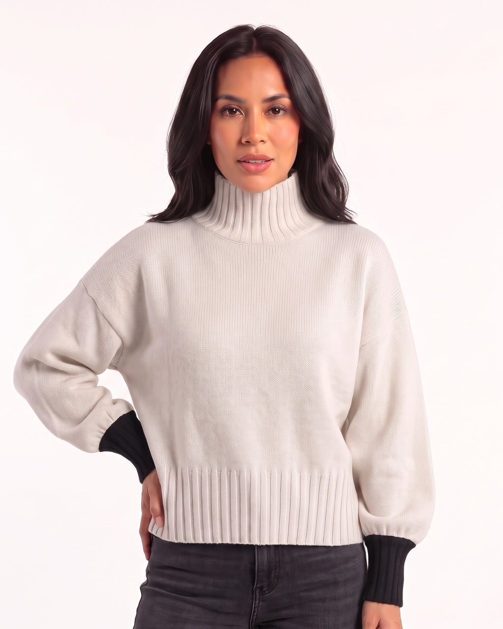 White oversized turtleneck knit sweater with balloon sleeves and ribbed cuffs and hem