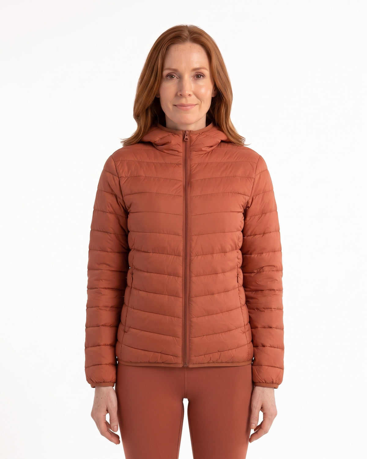 Women's hooded puffer down jacket in rust orange with full zip and side pockets
