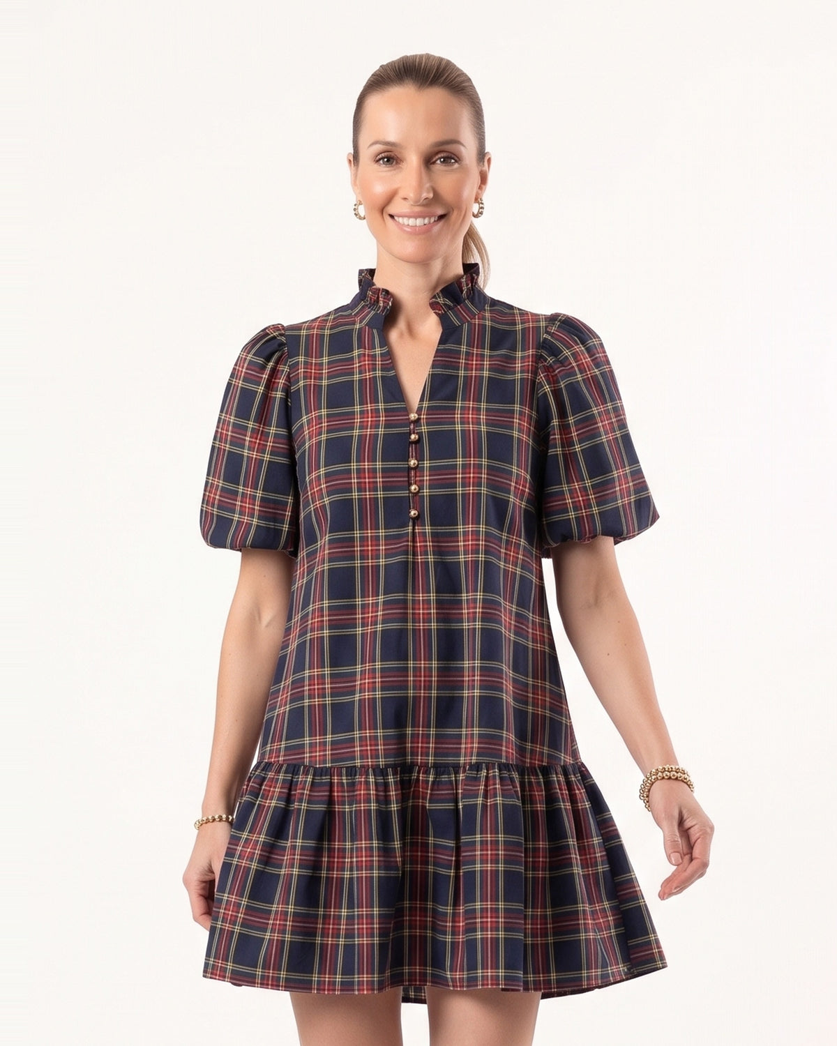 Front view plaid mini dress with puff sleeves and tiered skirt, navy base plaid