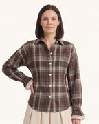 Women’s plaid flannel button-up shirt with lace-trim cuffs and soft gathered sleeves