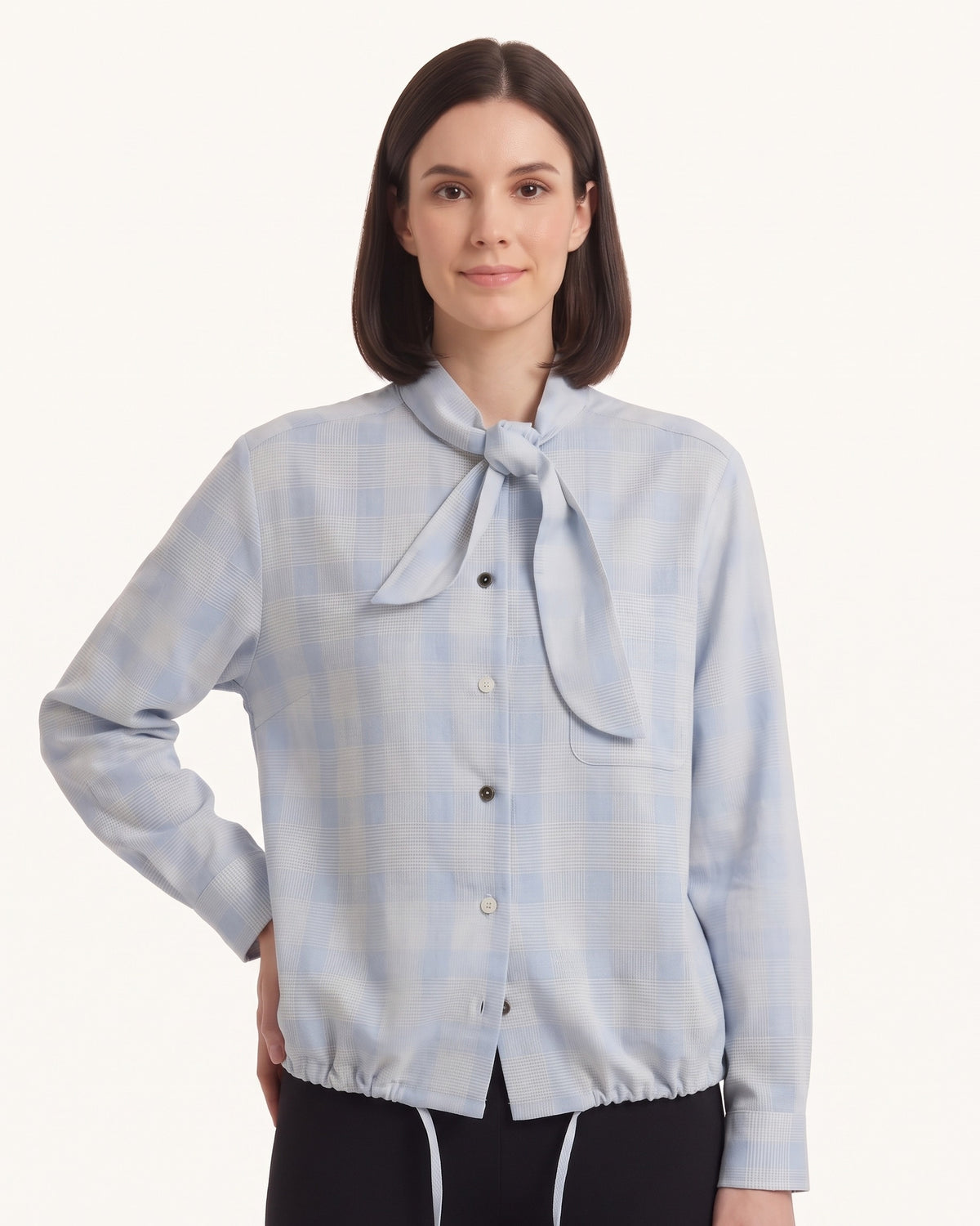 Light blue plaid tie-neck button-up blouse with long sleeves and button front