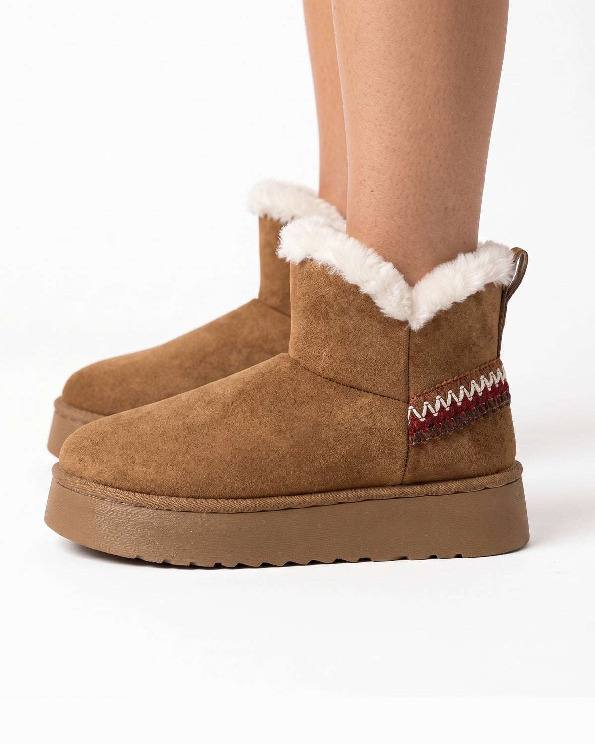 Brown platform snow boots in faux suede with faux fur trim and slip-on ankle design