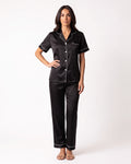 Women's satin pajama set in black: notch-collar button top with matching cropped pants