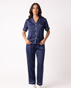Navy satin pajama set with short-sleeve button top and ankle-length pants