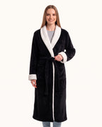 Women’s black plush fleece robe with white shawl collar, belt tie, long sleeves.