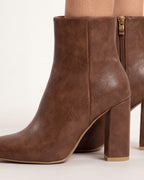 Women's brown faux leather ankle booties with pointed toe, block heel, side zip
