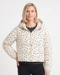 Cream polka dot cropped hooded puffer jacket on model, front zipper and hood.