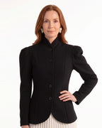 Black fitted blazer with stand collar, puff sleeves, and button front, model front view
