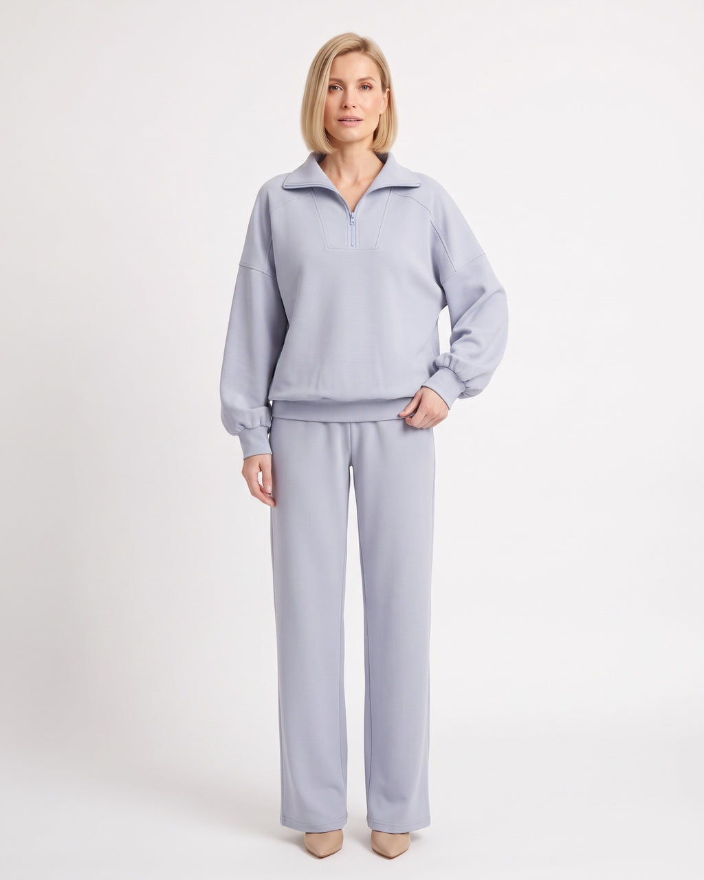 Light blue two-piece sweatsuit with quarter-zip pullover and wide-leg pants