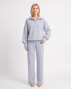 Light blue two-piece sweatsuit with quarter-zip pullover and wide-leg pants