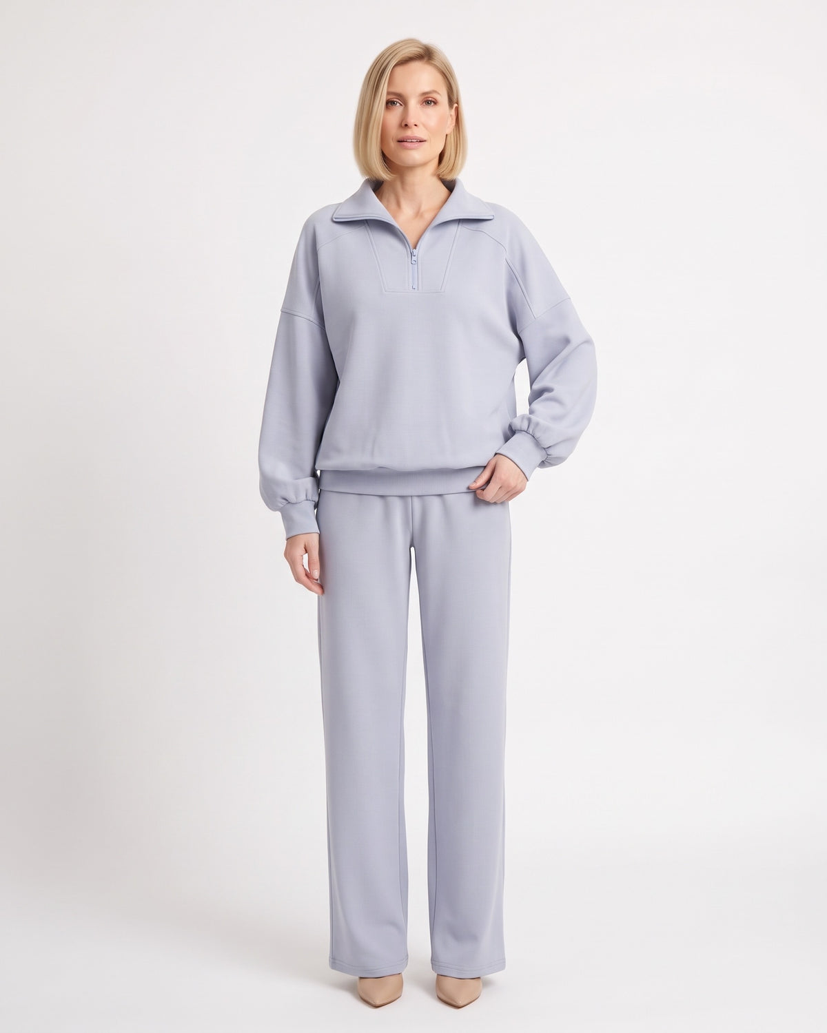 Light blue two-piece sweatsuit with quarter-zip pullover and wide-leg pants