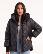 Black quilted hooded puffer jacket with zip front and diamond stitching, snap cuffs