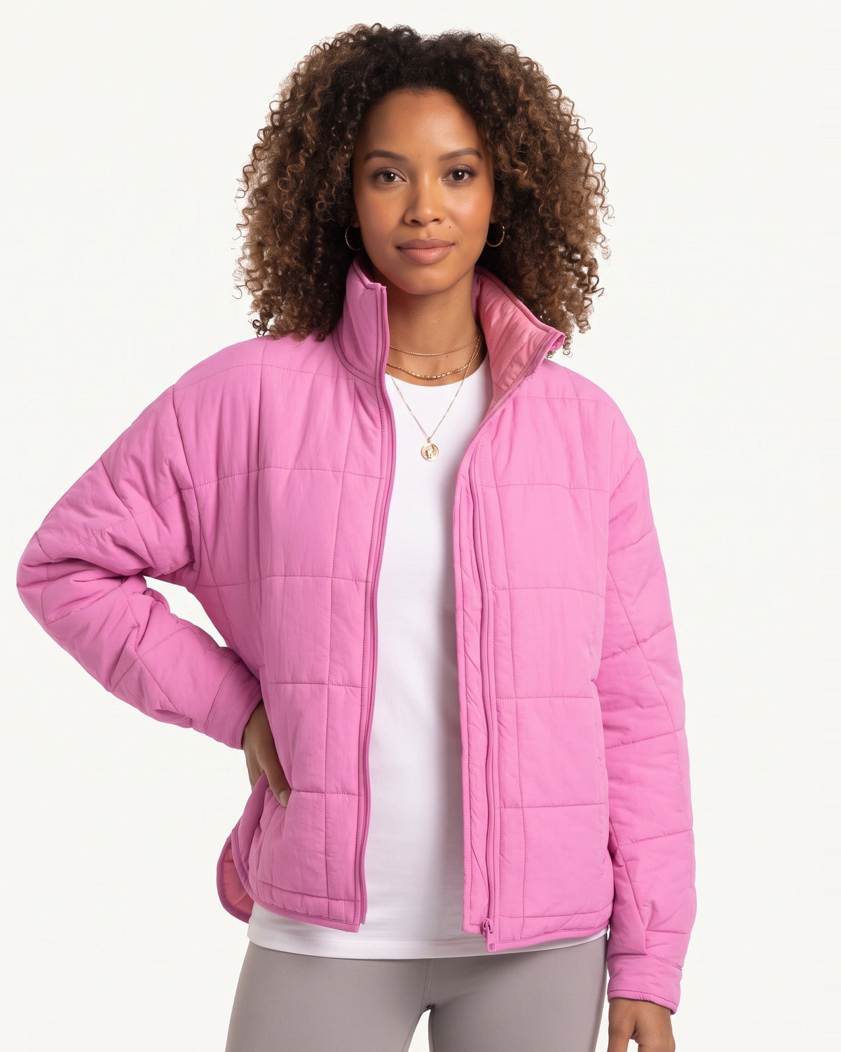 Bright pink lightweight quilted puffer jacket with stand collar and full-zip