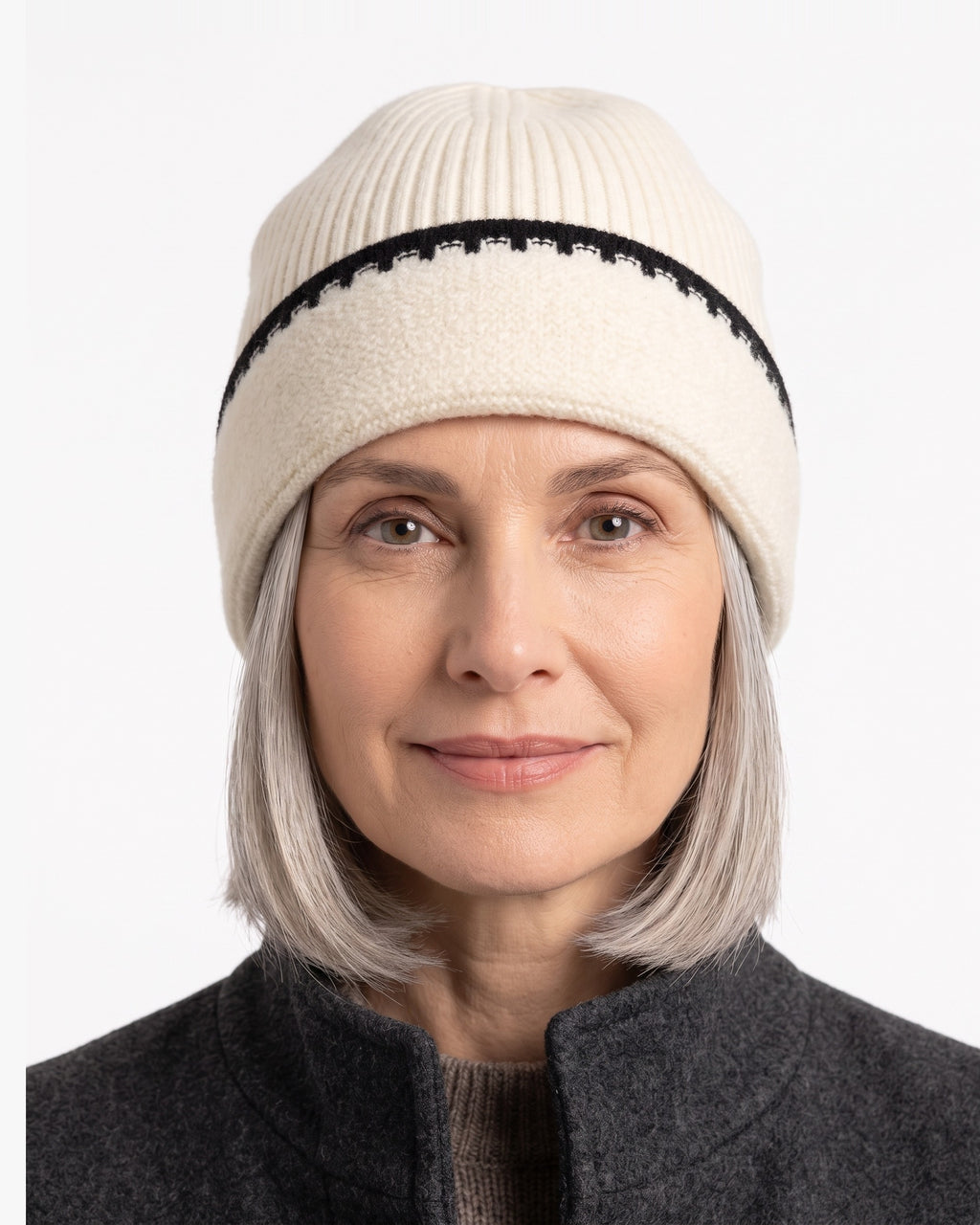 Cream ribbed knit beanie with black contrast stitch trim and folded cuff