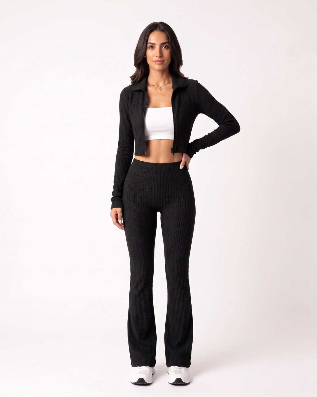 Black ribbed knit lounge set with cropped zip jacket and high-waist flare pants.