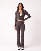 Charcoal taupe ribbed knit lounge set with cropped zip jacket and high-waist flare pants.