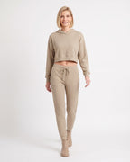 Beige cropped hoodie with kangaroo pocket and matching drawstring jogger pants set