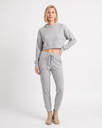 Light gray cropped hoodie with kangaroo pocket and matching drawstring jogger pants set