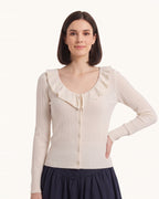 White knit cardigan with ruffle V-neck collar, button front, long sleeves