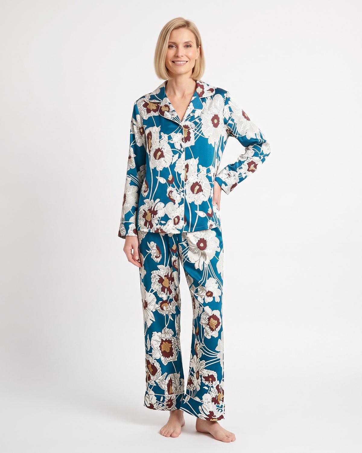 Women's satin pajama set with long-sleeve shirt and tapered pants; blue floral print