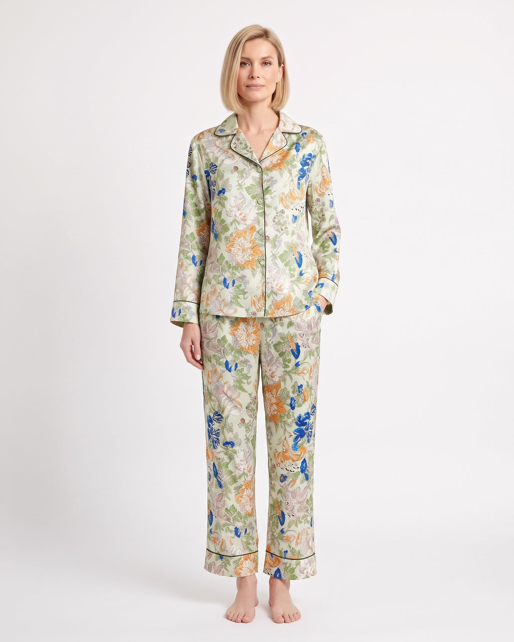 Women's satin pajama set with long-sleeve shirt and cropped pants; light floral and bird print