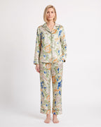 Women's satin pajama set with long-sleeve shirt and cropped pants; light floral and bird print