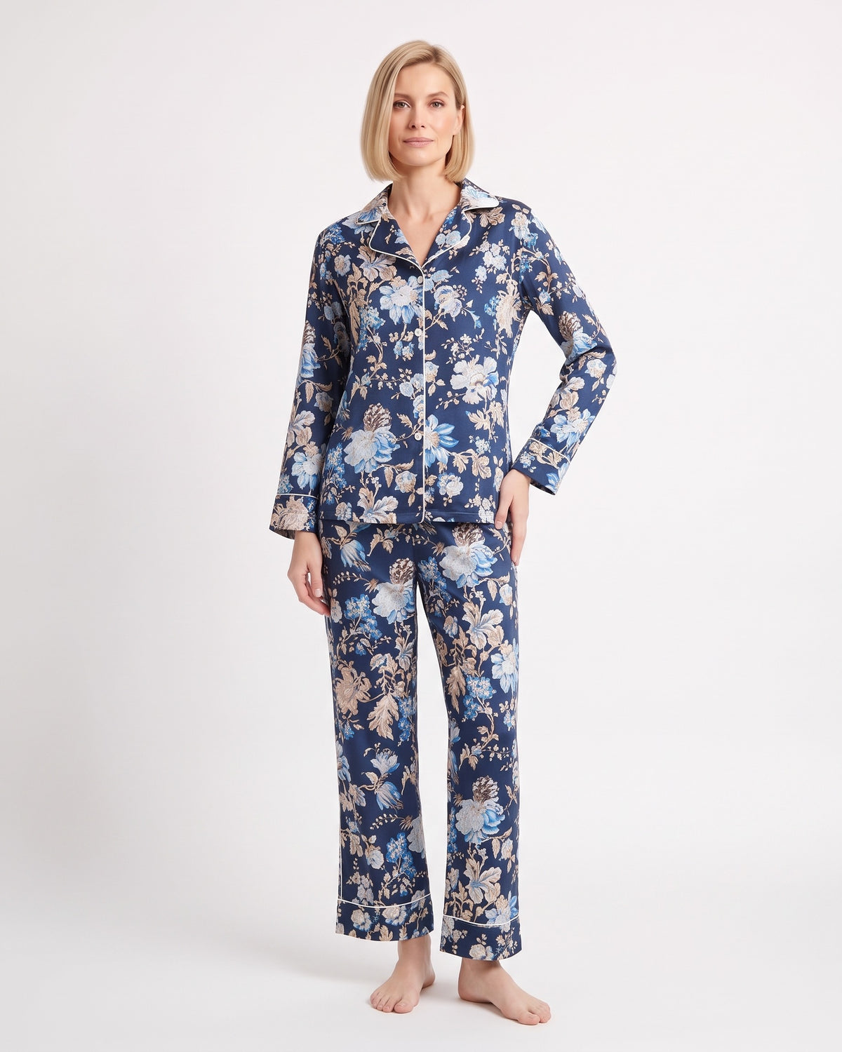 Women's satin pajama set with long-sleeve button shirt and straight pants; navy floral print