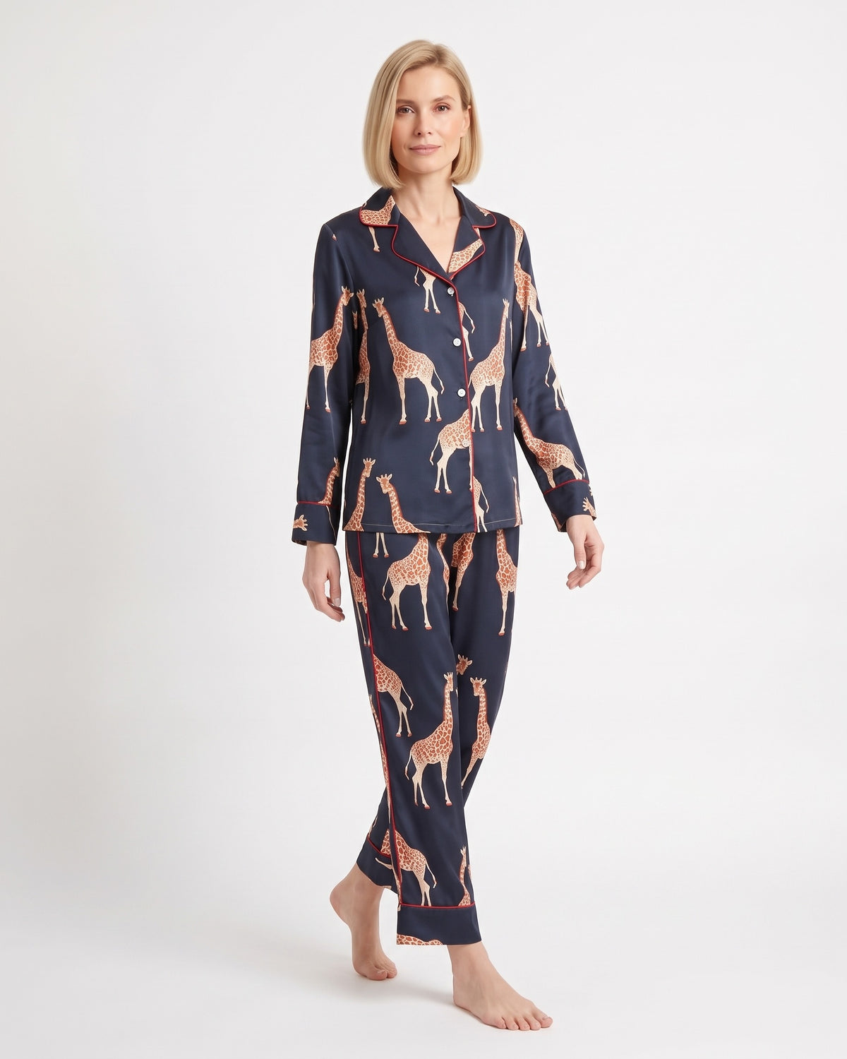 Women's satin pajama set with long-sleeve button shirt and tapered pants; navy animal print