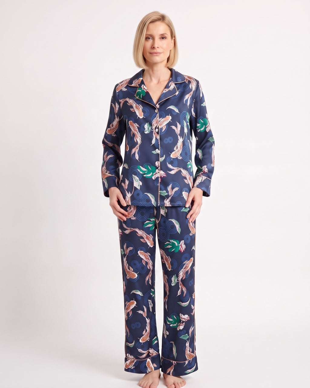 Women's satin pajama set with long-sleeve shirt and wide-leg pants; navy floral animal print